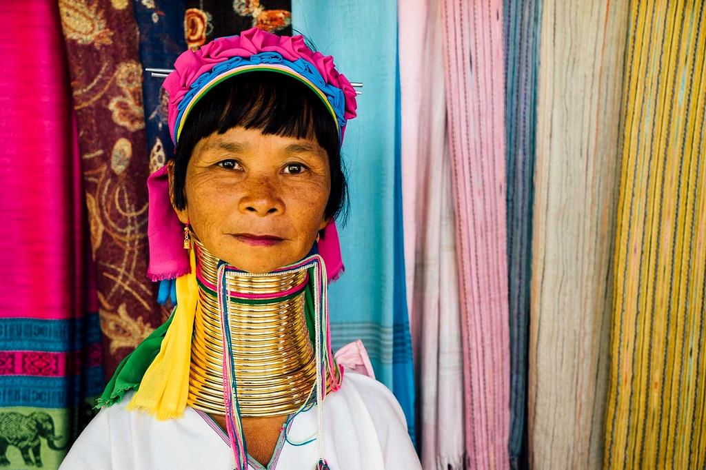 Local community members teaching traditional crafts to visiting families
