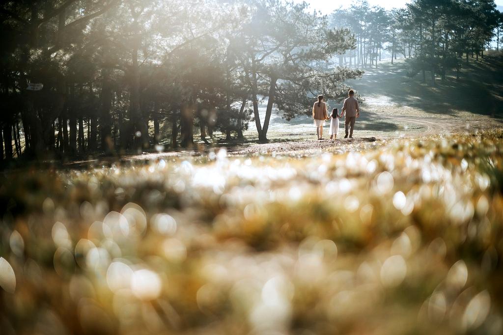 Happy family with children exploring mountain landscape during vacation