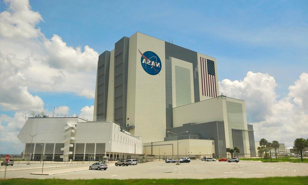 Electric shuttle bus transporting family tourists in nature reserve