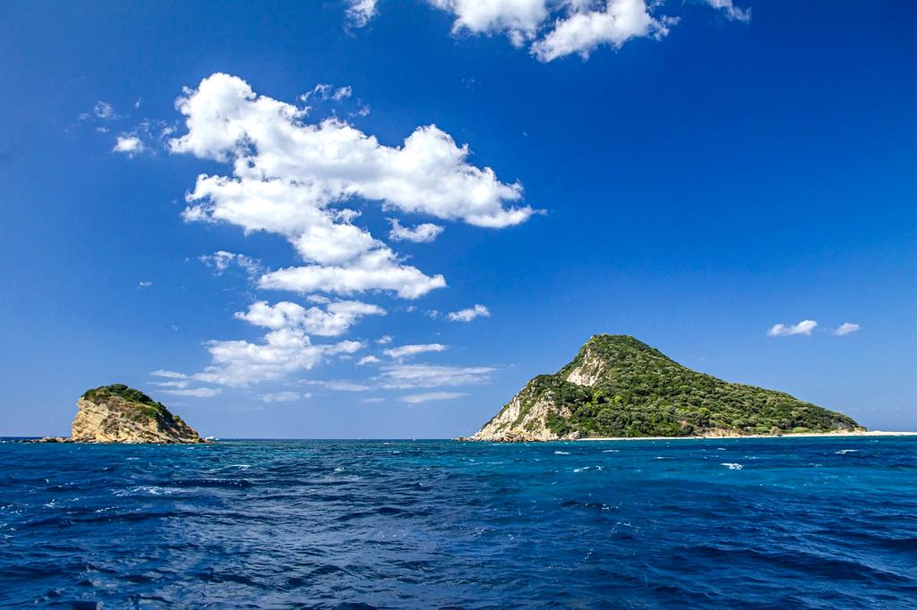 Family snorkeling in crystal clear tropical waters
